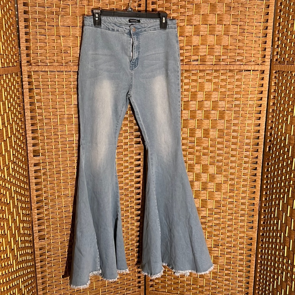 Bell bottom denim jeans that are light in color. They do stretch. Back pockets.